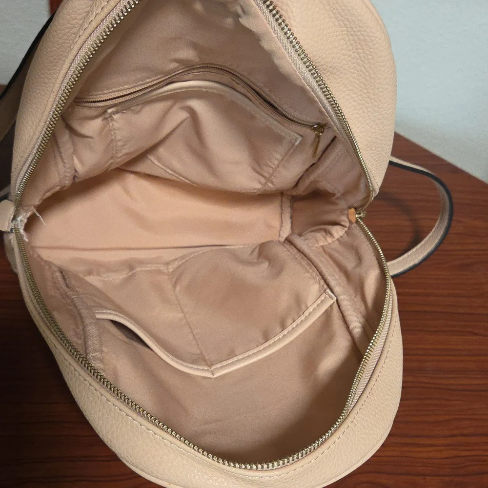 Elegant Light Pink Backpack with Gold Accents